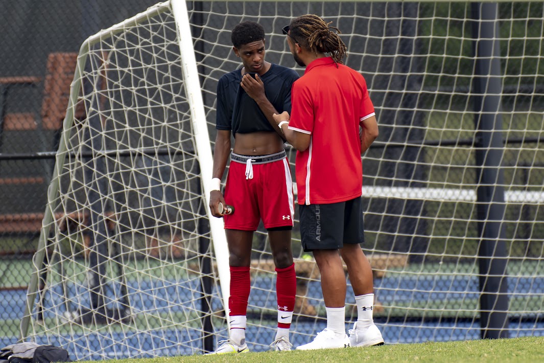 Coach Justin Wilson with player