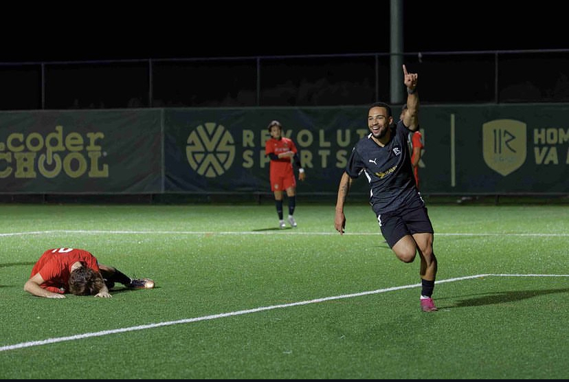 Justin Wilson celebrating a goal